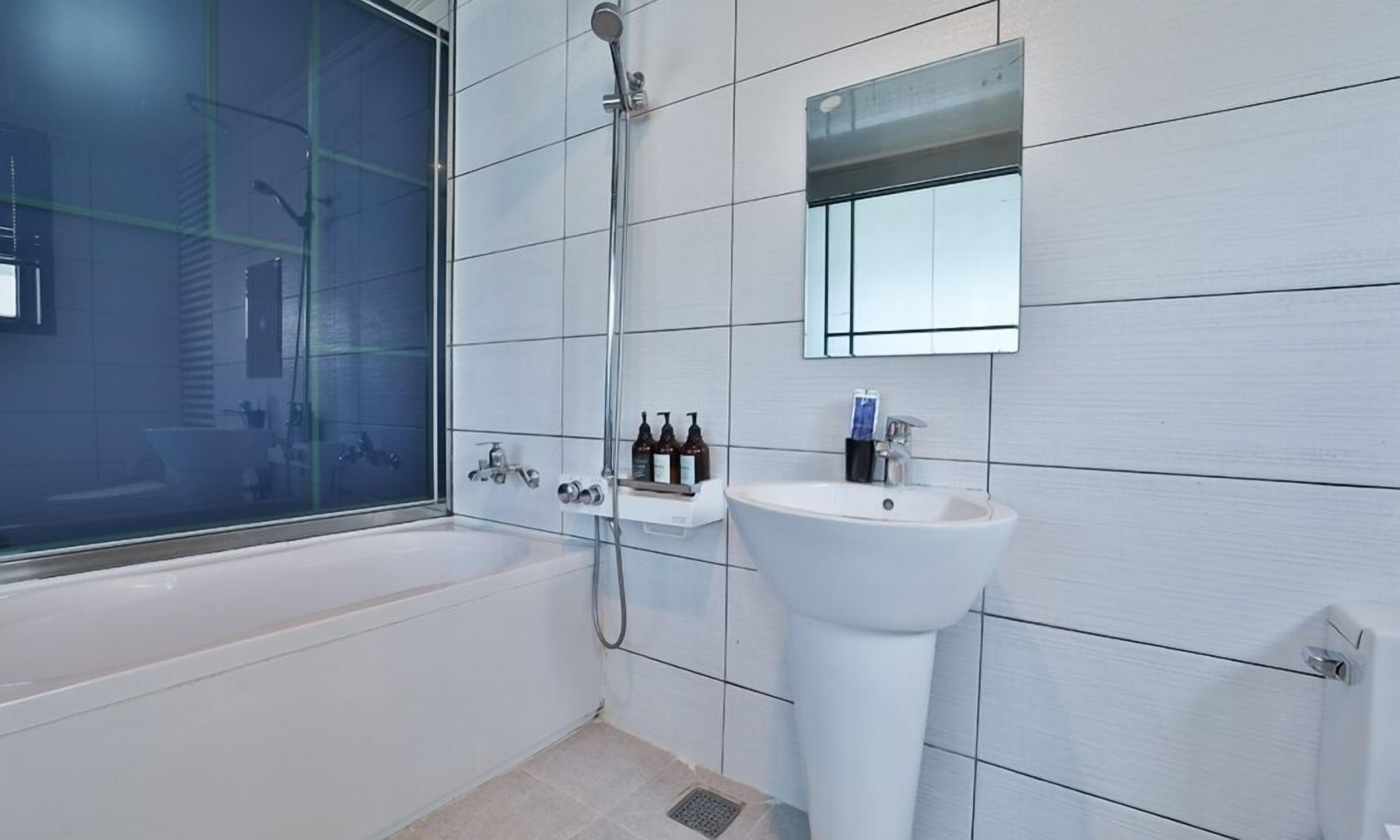 separate bathtub and shower, free toiletries, hair dryer, slippers