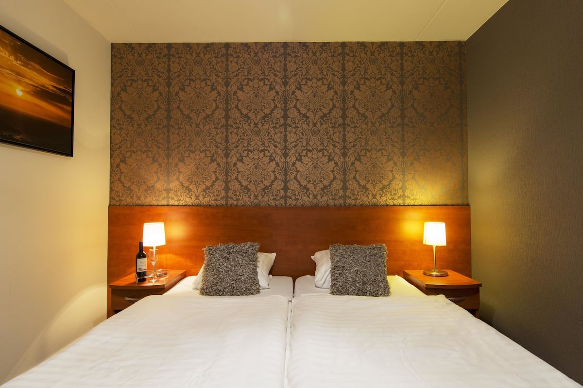 premium bedding, desk, blackout curtains, free wifi