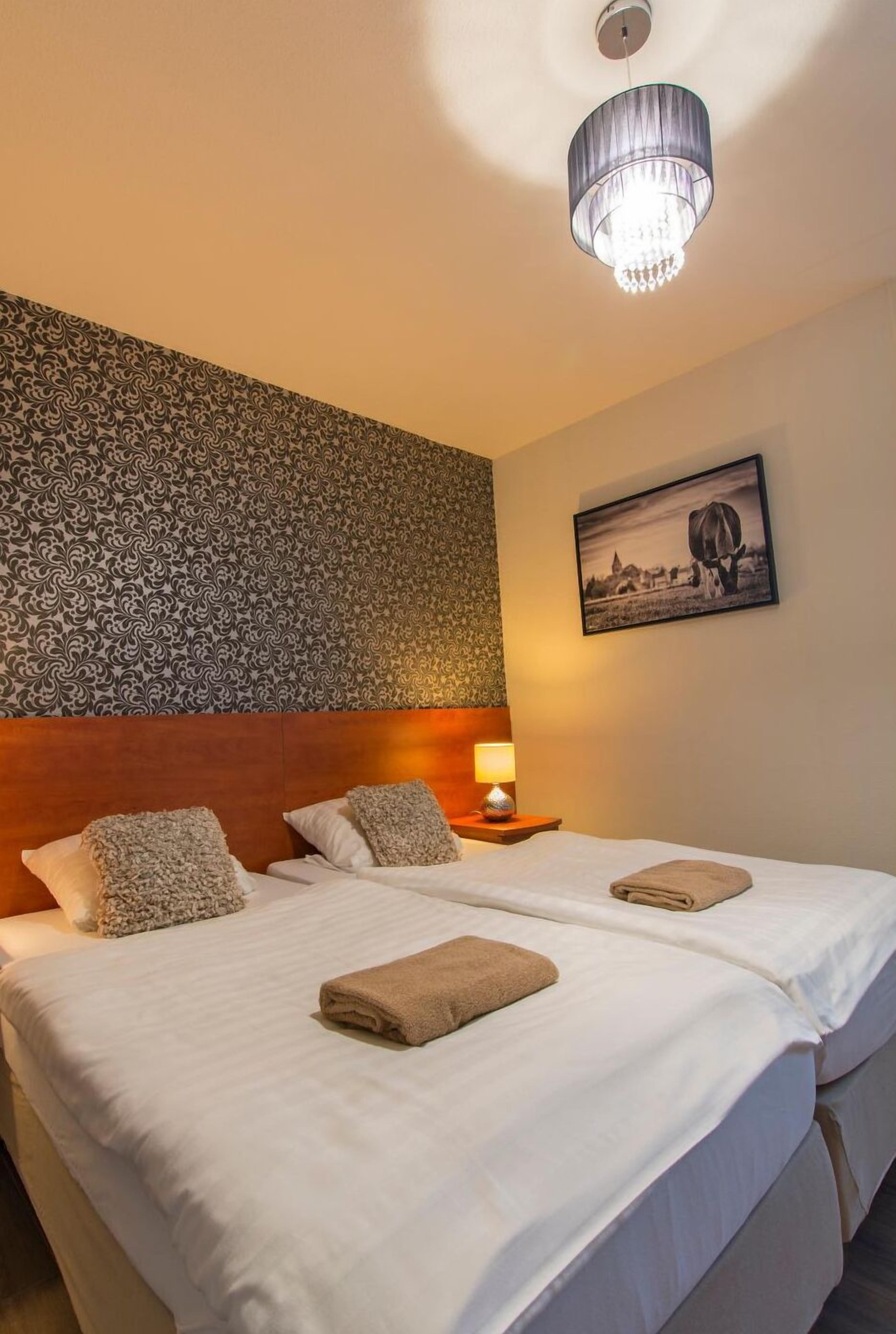 premium bedding, desk, blackout curtains, free wifi