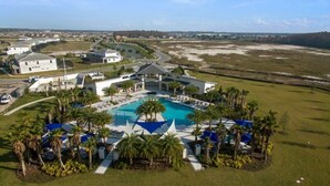 A resort with a large pool, palm trees, and a view of the surrounding landscape. - Aco238645 - Sonoma Resort - 7 Bed 6.5 Baths Villa (Kissimmee)