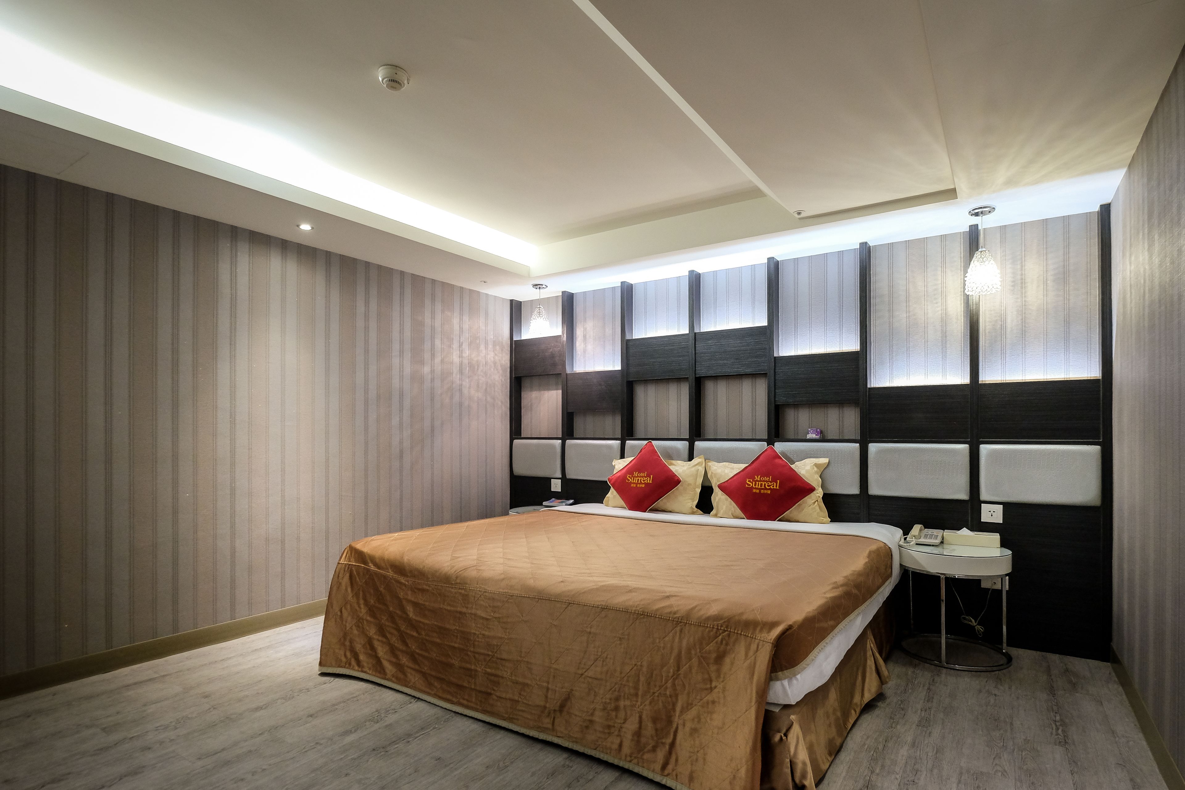 deluxe double room, 1 king bed | free minibar, individually furnished, desk, blackout curtains