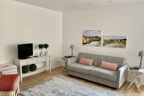 Flat-screen TV, iPod dock