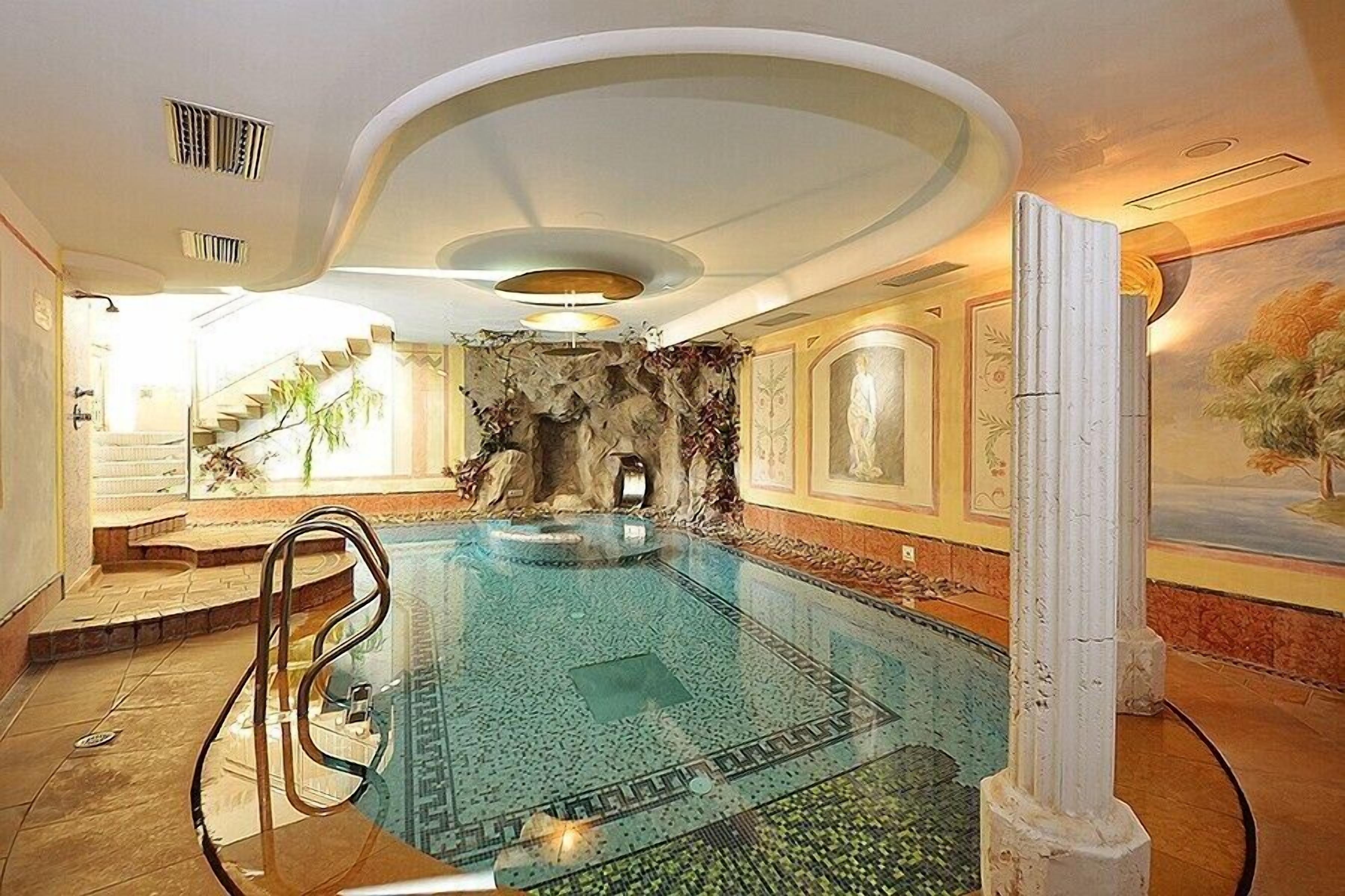 Indoor pool, open 2:30 PM to 7:30 PM, pool loungers