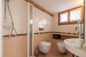 A bathroom with a shower, toilet, bidet, and sink. - RIALTO ROOFTOP TERRACE MINI LOFT (Venice)