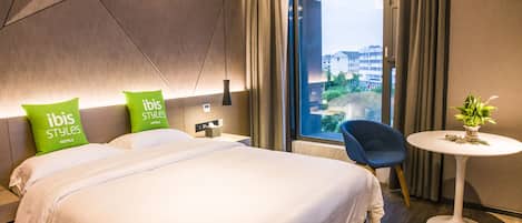 Standard Room | Premium bedding, desk, blackout curtains, soundproofing