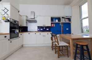 Full-sized fridge, microwave, coffee/tea maker, cookware/dishes/utensils