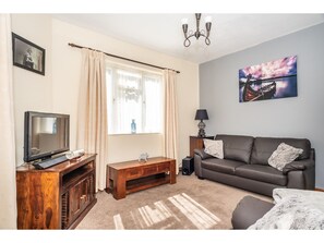 House, Multiple Beds (3 Bedrooms) | Living area | 40-inch TV with digital channels