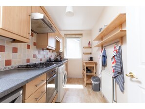 Full-sized fridge, microwave, coffee/tea maker, cookware/dishes/utensils