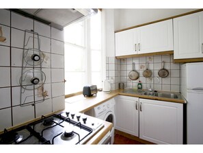 Full-sized fridge, microwave, coffee/tea maker, cookware/dishes/utensils