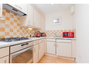 Departamento (2 Bedrooms) | Cocina privada | Refrigerador con congelador, horno, parrilla de estufa y tostadora