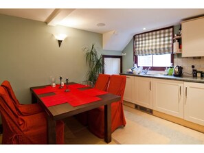 Full-sized fridge, microwave, coffee/tea maker, cookware/dishes/utensils