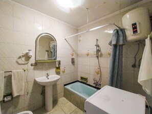 A bathroom with a sink, mirror, shower, and a bathtub. - Beautiful sea view Apt,in the heart of Alexandria  (Alexandria)