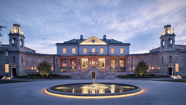A grand building with a central staircase, a fountain in the courtyard, and two towers with clock faces. - The Langley, a Luxury Collection Hotel, Buckinghamshire (Slough)