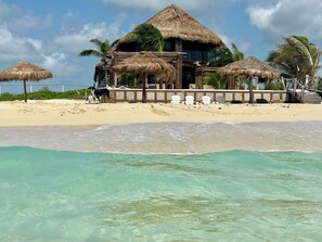 On the beach, sun-loungers, beach umbrellas, beach towels