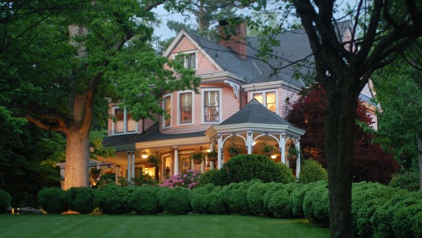 A large, two-story house with a wrap-around porch and a gazebo. - Beaufort House Inn (Asheville)