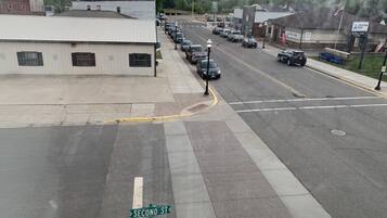 A street view with a building labeled 'American Bank' and a '24 Hour ATM' sign.
