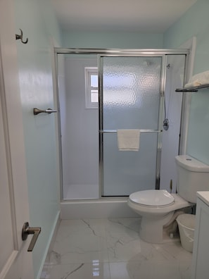 Shower, hair dryer, towels, soap