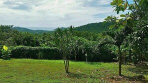Surrounded by lush greenery and rolling hills, this serene landscape offers a peaceful escape.