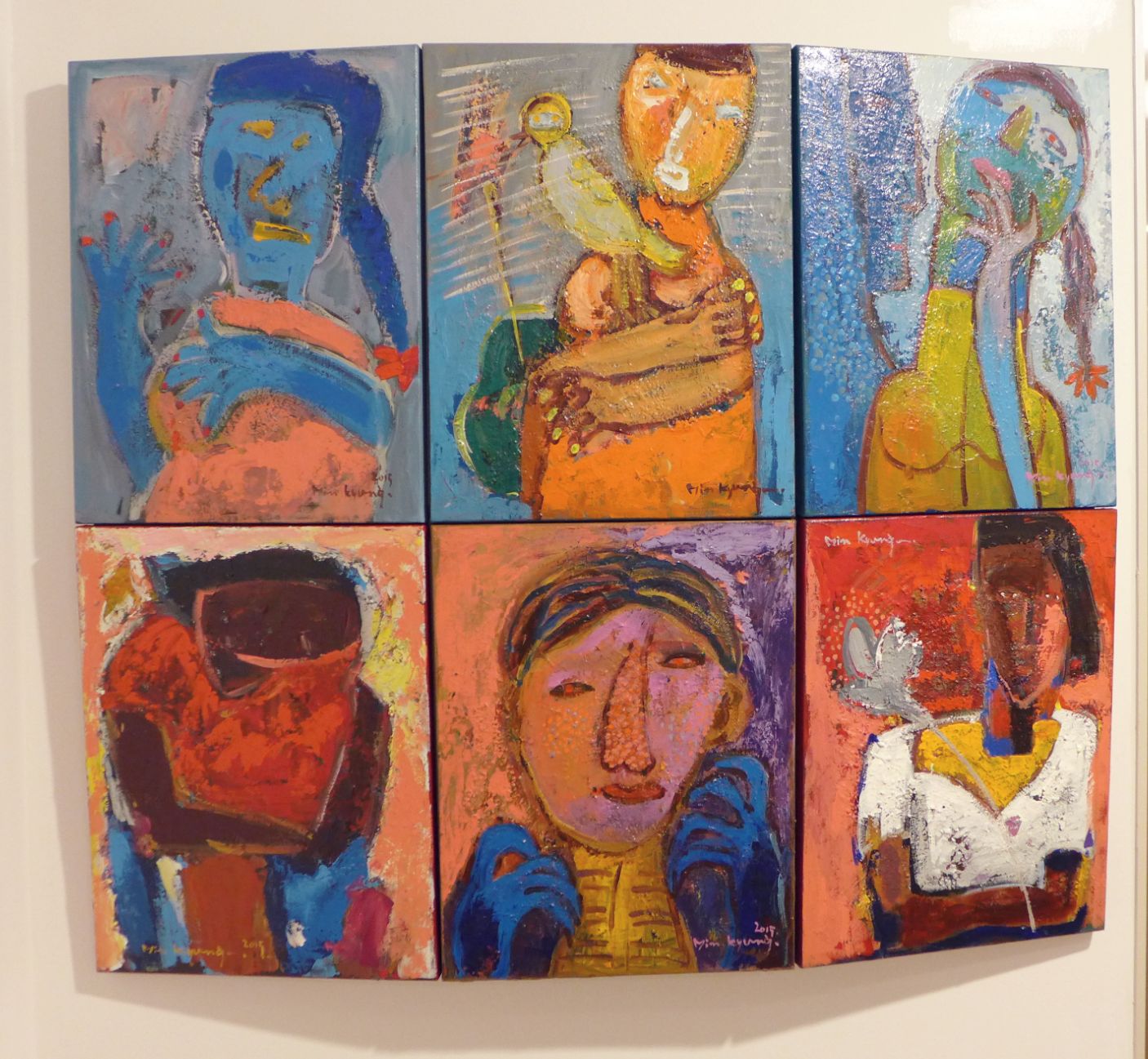 A six-panel artwork with abstract human figures in various poses and colors.