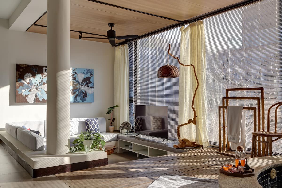 A modern living room with a sofa, TV, and a coffee table.