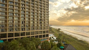 A high-rise hotel with multiple balconies overlooking a beach. - Oceanfront Suite w/Amazing View + Official On-Site Rental Privileges (North Myrtle Beach)