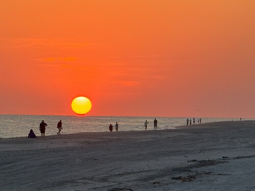End unit with extra windows. Steps to the beach, private beach access!
