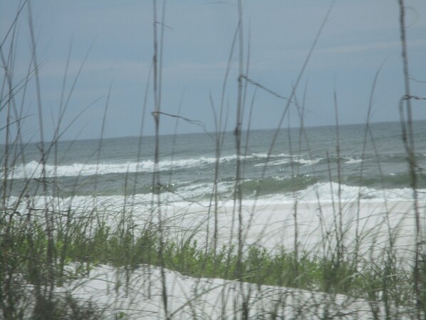 A beach with waves and sand.