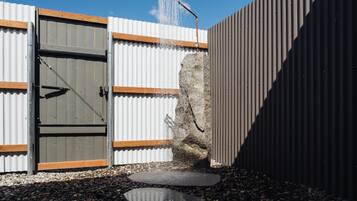 Shower, rainfall showerhead, designer toiletries, hair dryer