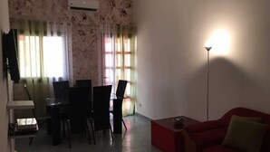 Deluxe Apartment, 3 Bedrooms | Living area | LCD TV - Stay.plus Appartements Maristes (Dakar)