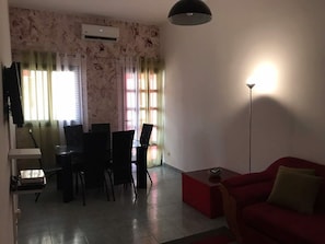 Deluxe Apartment, 3 Bedrooms | Living area | LCD TV