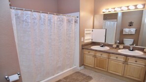 Family Condo, Garden Area | Bathroom | Combined shower/tub, rainfall showerhead, hair dryer, towels