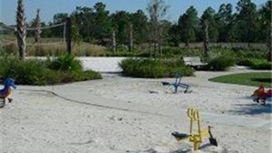 A sandy beach with a yellow swing set and a red ball in the background. - Ws305 - Watersong - 5 Bed 5 Baths Villa (Davenport)