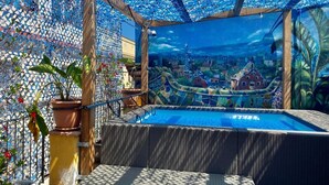 A pool area with a clear view of a cityscape through an aquarium-like structure. - Amfores Boutique Guest House (Barcelona)