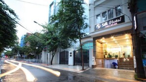 A hotel entrance with a sign reading "Silk Hotel" and a visible entrance gate. - RedDoorz Plus near Tan Son Nhat Airport 2 (Ho Chi Minh City)