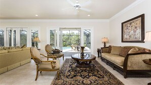 A spacious living room with a sofa, chairs, a coffee table, and a rug. - Je47048 - Reunion Resort - 4 Bed 4 Baths Villa (Kissimmee)