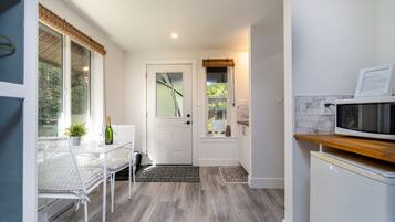 CREEKSIDE COTTAGE - HOT TUB | Living area | 42-inch flat-screen TV with cable channels, TV