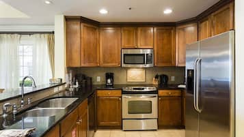 Family Condo, Balcony, Garden Area | Shared kitchen | Fridge, microwave, oven