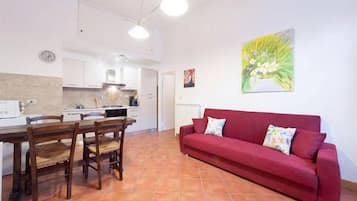 Apartment, 1 Bedroom | Living area | Flat-screen TV