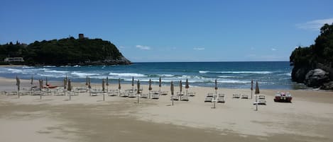 Private beach, white sand, sun loungers, beach umbrellas