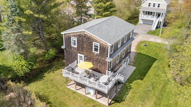 A two-story house with a balcony, surrounded by trees. - 1 Block to Beach -large deck overlooking  beautiful  yard - Cul-de-sac (York)