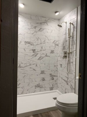 Bathtub, hair dryer, towels, soap