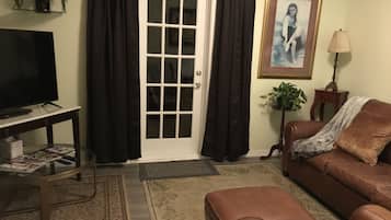 Flat-screen TV, DVD player, books, video library