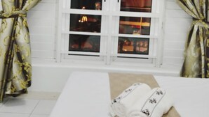 A room with a window, curtains, and a bed. - HomeStay Nimah Seaview (George Town)