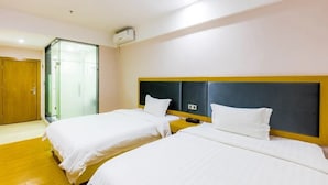 A hotel room with two beds, a wooden wardrobe, and a glass door leading to a shower area. - Jinlizhou Hotel (Zhuhai)