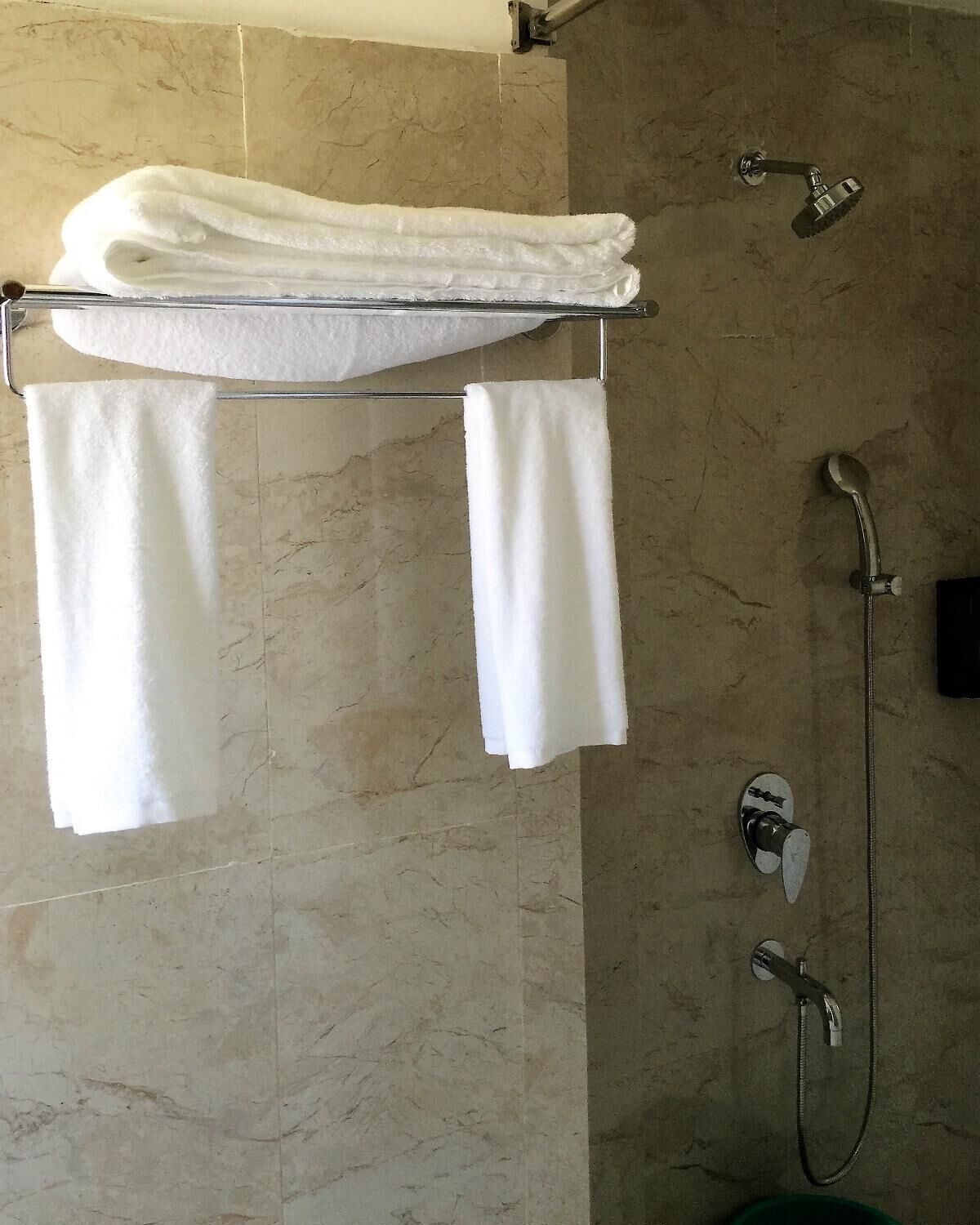 Shower, rainfall showerhead, hair dryer, slippers
