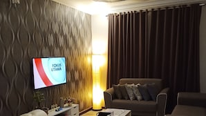 Family Apartment, 3 Bedrooms, Non Smoking | Living area | 43-inch flat-screen TV with satellite channels, LCD TV