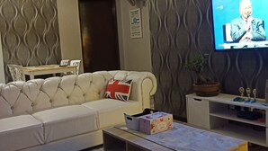 Family Apartment, 3 Bedrooms, Non Smoking | Living area | 43-inch flat-screen TV with satellite channels, LCD TV