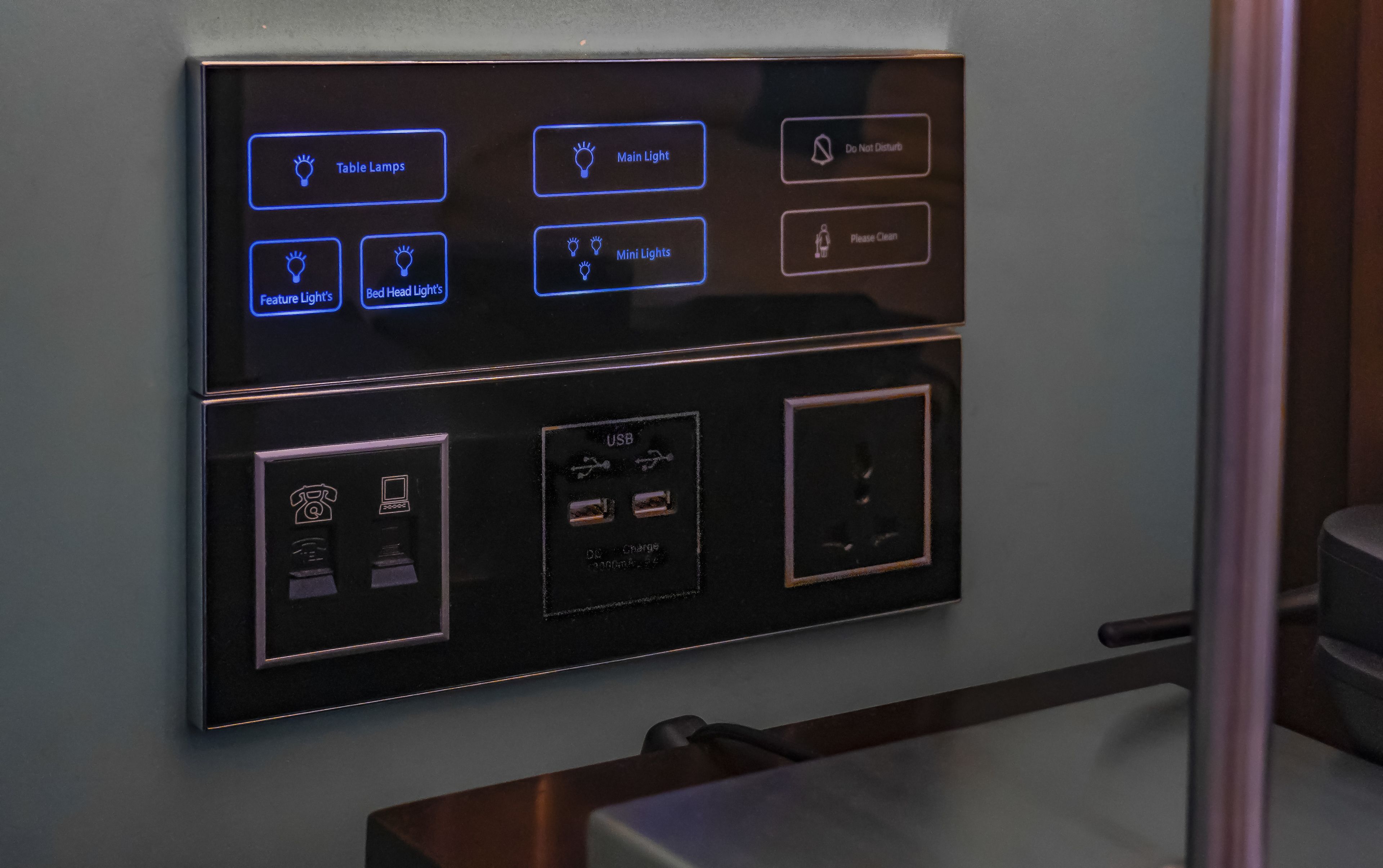 A control panel with various lighting options including table lamps, main light, mini lights, feature light, and bed head lights.