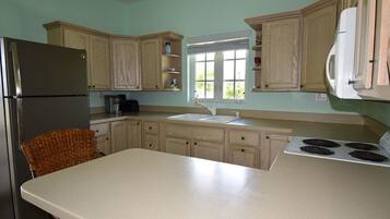 Full-sized fridge, oven, cookware/dishes/utensils