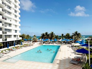 A heated pool, sun loungers